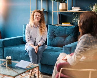 a woman sitting on a couch