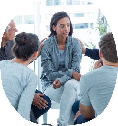 a group of people sitting in a circle
