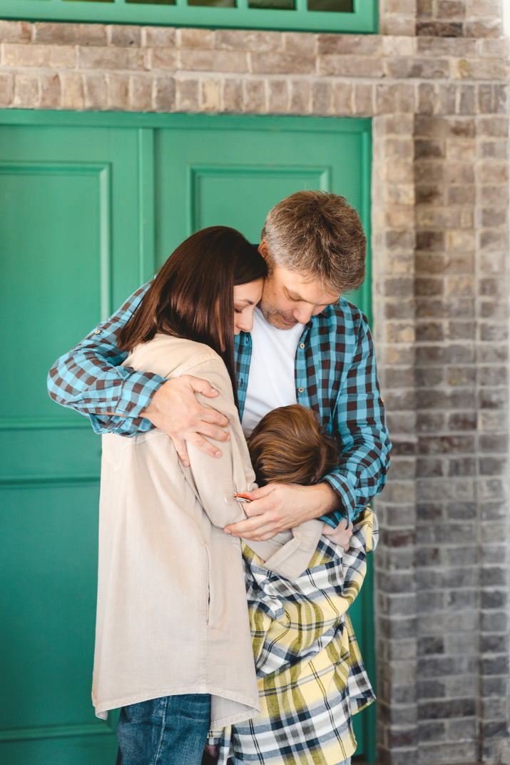 a family huging each other after counceling