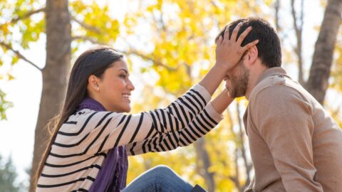 a woman touching a man's head after couples therapy at REACH